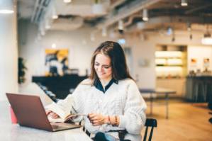 businesswoman-working-on-laptop-in-modern-coworkin-2022-02-02-03-56-23-utc